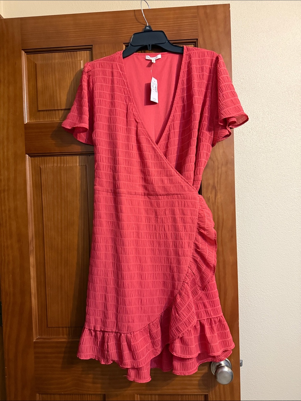 Brand new size XL Women’s Coral Wrap Ruffle Dress from Maurice’s.